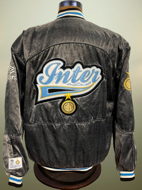 Gray Inter Milan Umbro Varsity Jacket with 'Inter' logo on a mannequin against a gray background