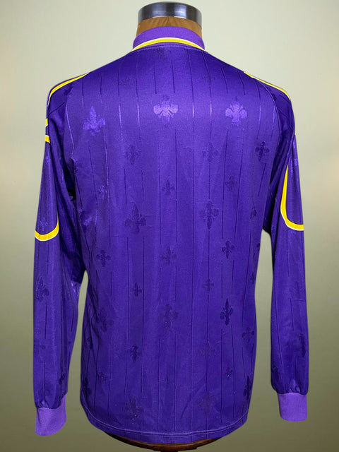 Purple Fiorentina 1997-98 Shirt with yellow accents on a mannequin against a beige background