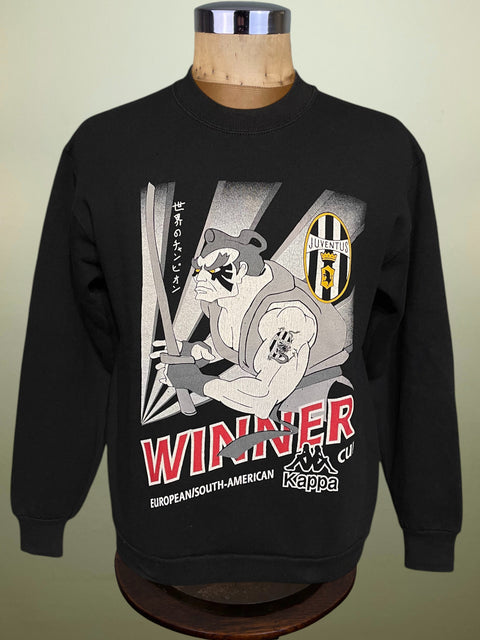 Black Juventus Kappa Intercontinental Cup Winner sweatshirt with graphic design on a mannequin against a beige background
