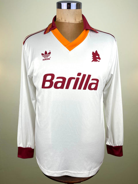 White AS Roma 1992-93 away jersey made by Adidas with red and orange accents on a mannequin against a neutral background