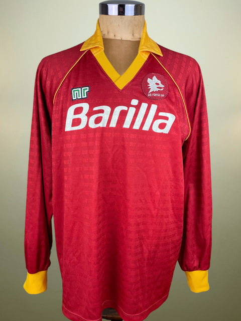 Red AS Roma 1990-91 jersey made by Ennerre with yellow accents on a mannequin against a plain background