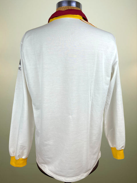 White AS Roma 1991 long-sleeve shirt with yellow accents on a mannequin against a neutral background