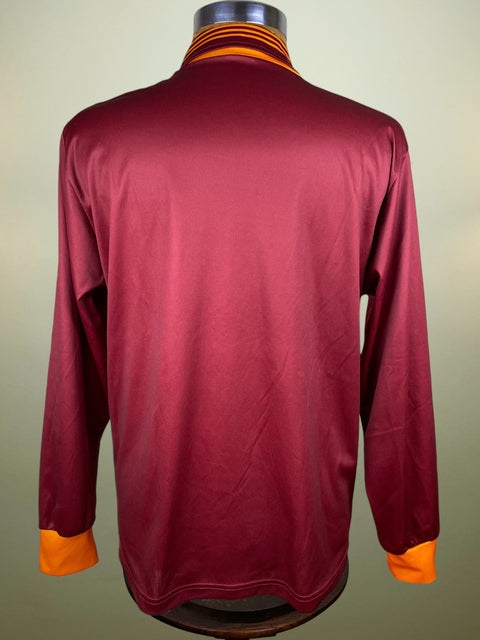 Maroon AS Roma 1993-94 Adidas jersey with orange accents on a mannequin against a neutral background