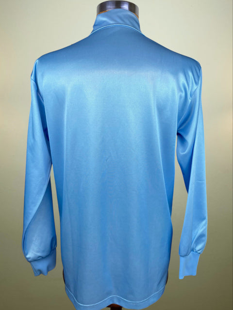Blue Napoli 1990-91 long-sleeve shirt on a mannequin against a beige background