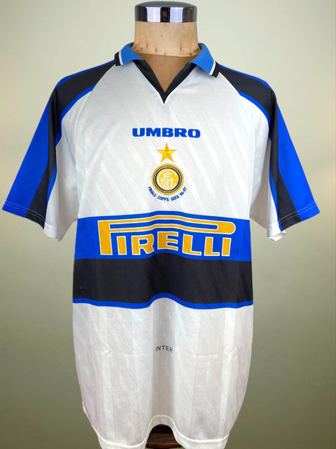 White Inter Milan UEFA Cup Final Away jersey with blue and black accents, featuring Umbro and Pirelli logos on a mannequin.