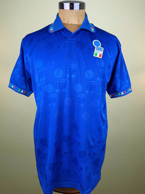 Blue Italy Diadora World Cup 94 shirt on a mannequin against a beige background