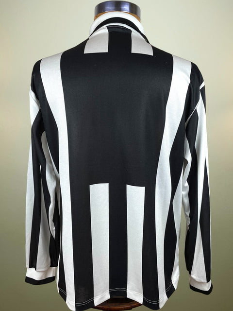 Black and white striped shirt Juventus Kappa Shirt from the 1994-95 Season on a mannequin against a neutral background