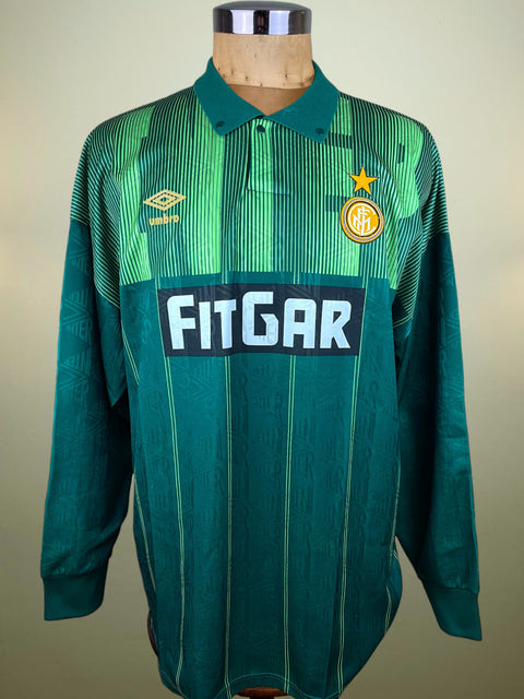 Green Inter Milan Goalkeeper jersey made by Umbro with FitGar branding on a mannequin against a beige background