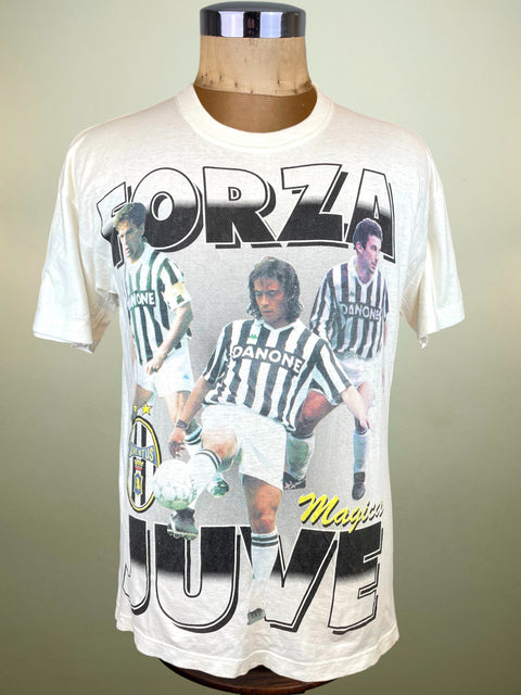 White t-shirt with soccer player graphics and text on a mannequin against a neutral background