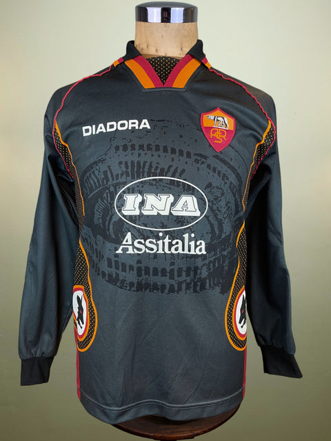 Black AS Roma Goalkeeper jersey with Diadora and INA Assitalia logos on a mannequin against a beige background
