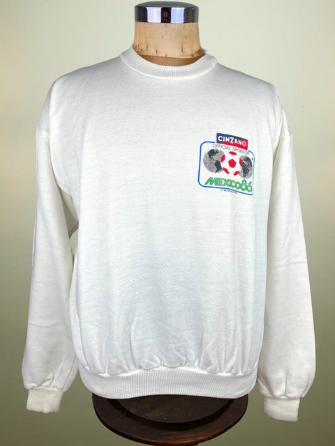 White Mexico 86 sweatshirt with Cinzano logo on a mannequin against a beige background