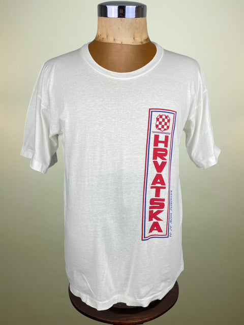White t-shirt with 'HRVATSKA' text and flag design on a mannequin against a beige background