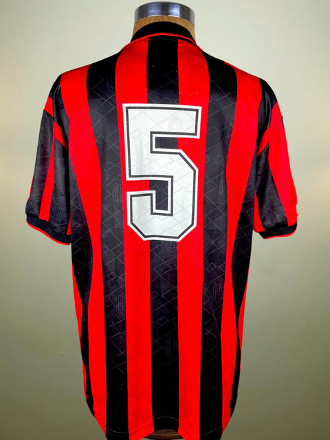 Black and red striped AC Milan 1993-94 home jersey with number 5 on a mannequin against a neutral background