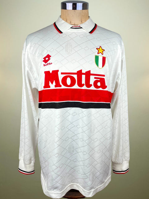White AC Milan Lotto Away 1993/94 jersey with red and black accents on a mannequin against a neutral background with Motta Sponsor on the chest.
