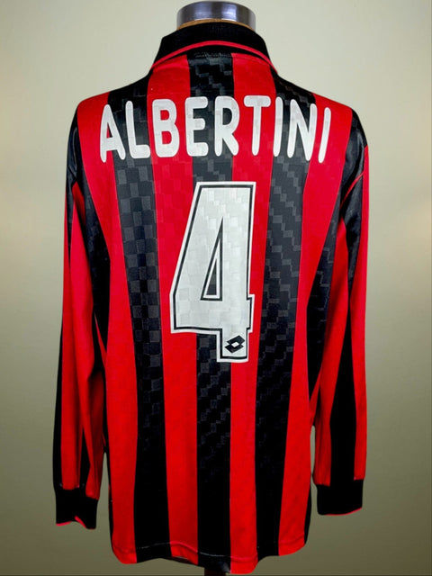 A soccer jersey with long sleeves, predominantly red with black stripes, displaying the name 'ALBERTINI' and the number '4' on the back.