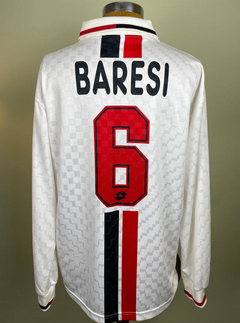 A short-sleeved soccer jersey with black, red, and white geometric pattern, featuring the name 'BARESI' and the number '6' on the back.