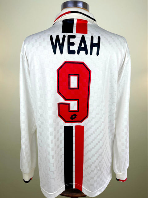 White sports jersey with 'WEAH' and number '9' on a mannequin against a beige background