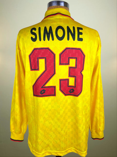 Yellow AC Milan third jersey fron the 1995-96 season with 'SIMONE' and number '23' on a gray background
