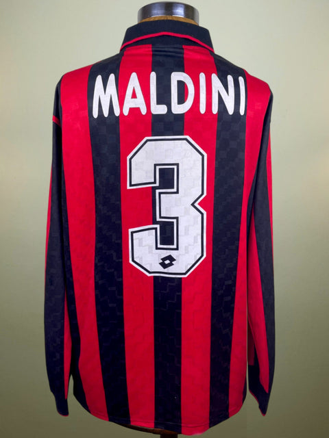 A soccer jersey with long sleeves, featuring the name 'Maldini' and the number '3' on the back, in red and black stripes.