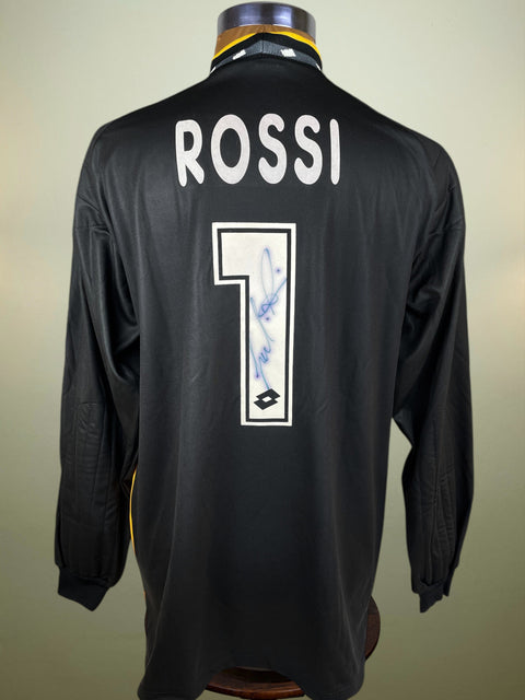 Black AC Milan Goalkeeper jersey with 'ROSSI' and number '1' on a mannequin against a beige background