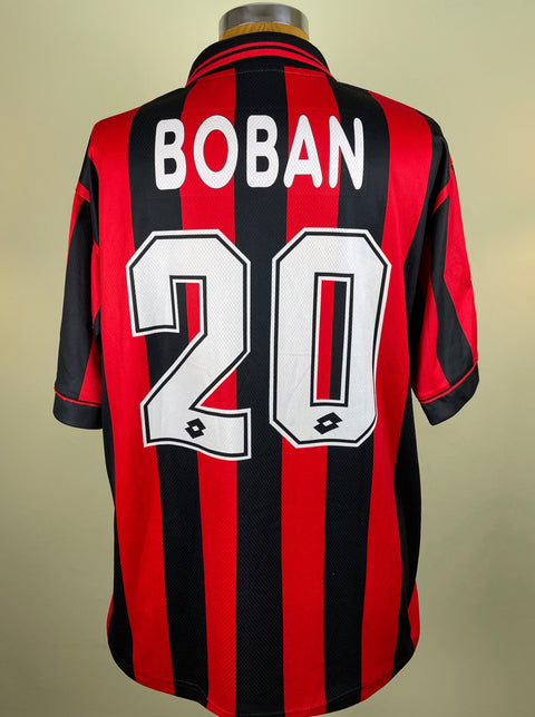 A short-sleeved soccer jersey with red and black stripes, the number 20 on the back, and the name 'BOBAN' above it. The jersey is displayed on a mannequin against a plain background.