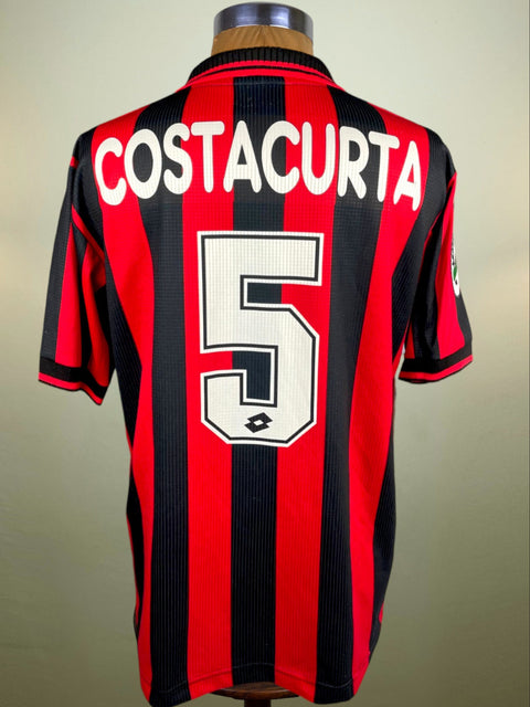 A jersey with a red and black vertical pattern, displaying the name 'COSTACURTA' and the number '5' on the back.