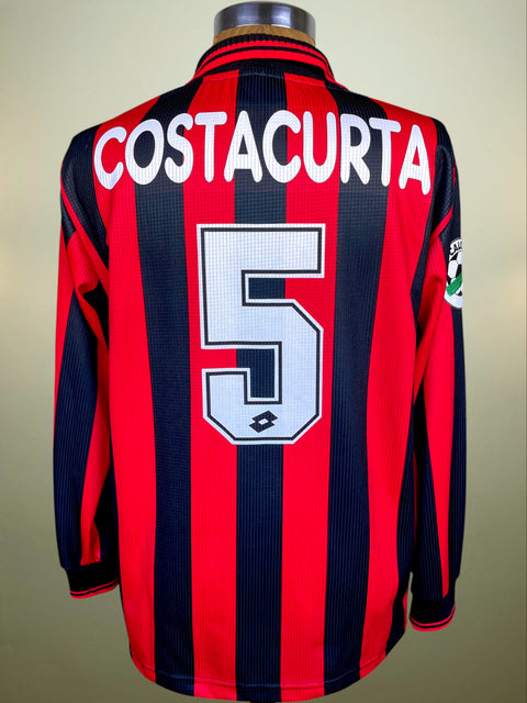 Red and black striped sports jersey with 'Costacurta' and number '5' on a beige background