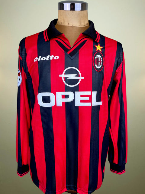 Red and navy striped sports jersey with Opel logo on a mannequin against a plain background