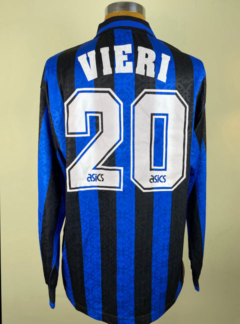A long-sleeved Atalanta 1995-96 jersey with a blue and black checkered pattern, featuring the name 'Vieri' and the number '20' on the back.