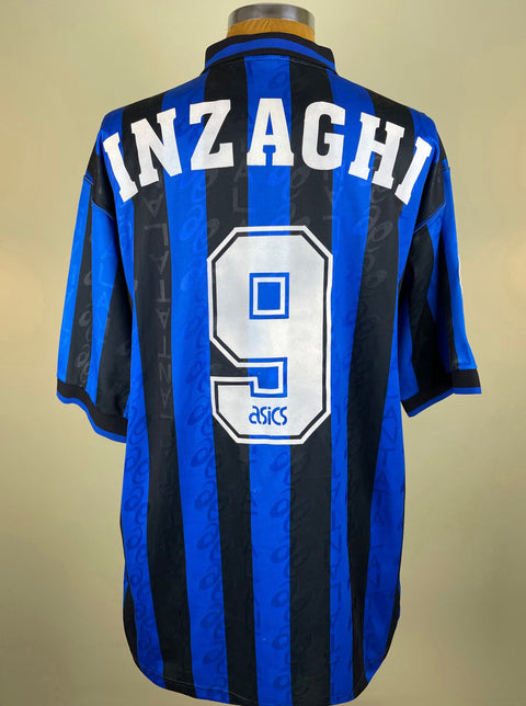 A short-sleeved Atalanta 1996-97 soccer jersey with blue and black stripes, number 9 on the front, and the name 'INZAGHI' across the back.