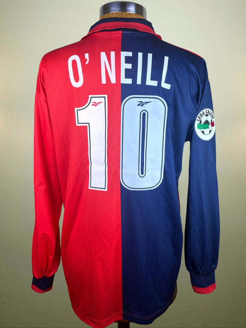 Half red and half blue Cagliari jersey with 'O'Neill' and number '10' on a plain background