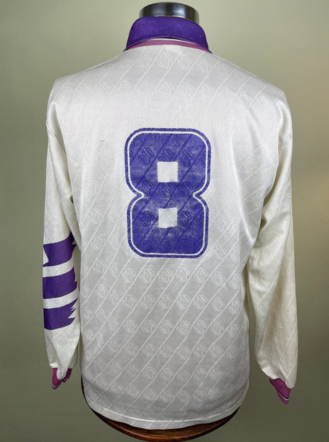 A long-sleeved 1990-91 Fiorentina jersey made by ABM featuring a geometric pattern with purple and gray stripes, the number 8 on the back
