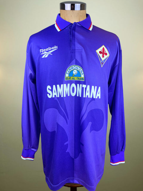 Purple Fiorentina jersey with Reebok and Sammontana logos on a mannequin against a neutral background