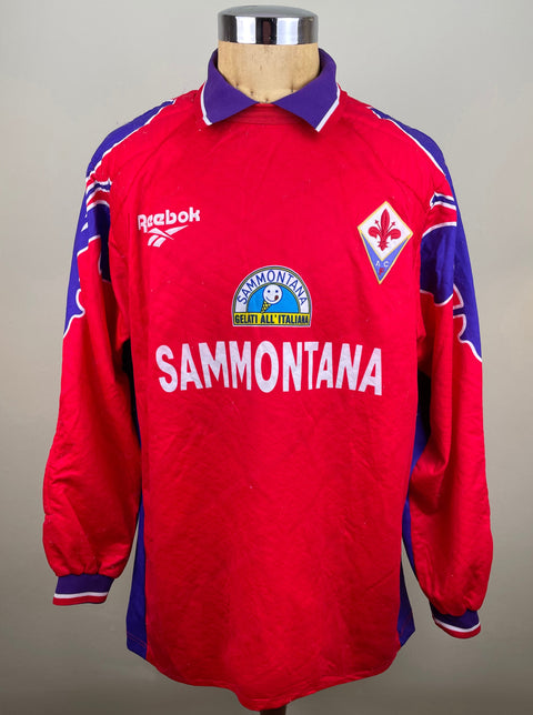 A red Fiorentina Goalkeeper jersey from the 1995-96 season, made by Reebok with Sammontana Sponsor across the chest.