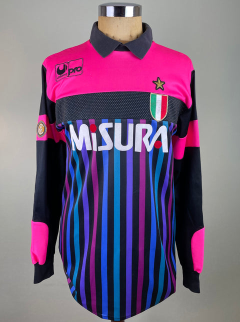 Walter Zenga's match worn long-sleeved Inter Milan 1989-90 jersey featuring a pink base with black and blue vertical stripes. The jersey has a v-neck collar, a button-up front, and displays the 'Inter' logo prominently on the chest.