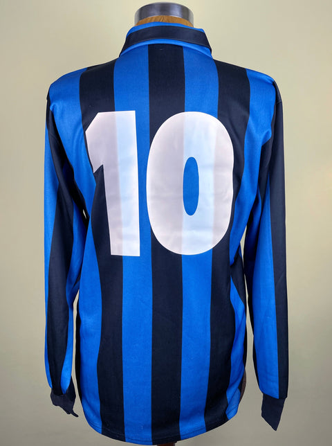 Lothar Matthaus's long-sleeved Inter Milan soccer jersey fron the 1990-91 season with blue and black stripes, with his number 10 on the back in light plastic.