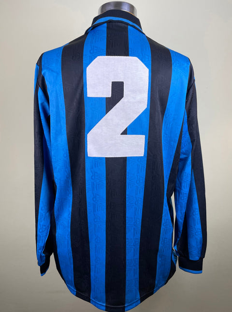 Beppe Bergomi's Match Worn Inter Milan 1991-92 long-sleeved soccer jersey with blue and black stripes, featuring is number 2 stitched onto the back of the shirt.