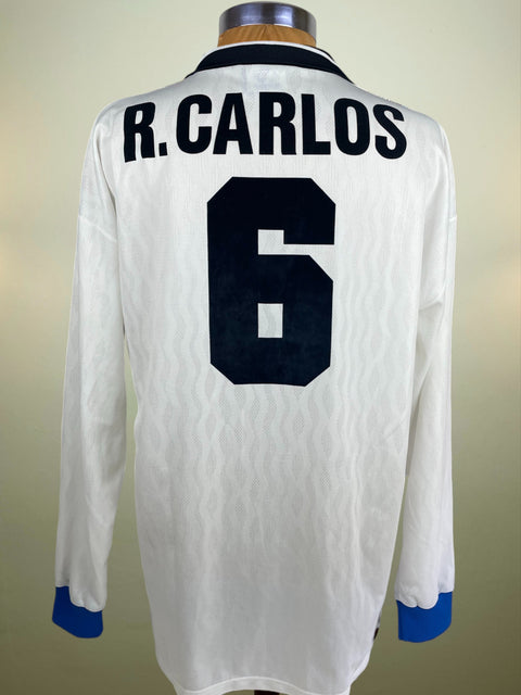 Inter away shirt in white from 1995/96, worn by Roberto Carlos. Long-sleeve Umbro issue with Pirelli sponsor, finished with ROBERTO CARLOS 6 in official flock.