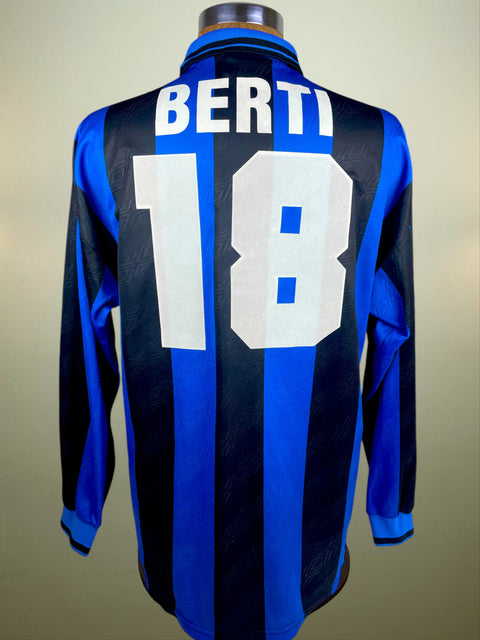 Inter home shirt in blue and black from 1995/96, worn by Nicola Berti. Long-sleeve Umbro issue with Pirelli sponsor, finished with BERTI 18 in flocked lettering and numerals.