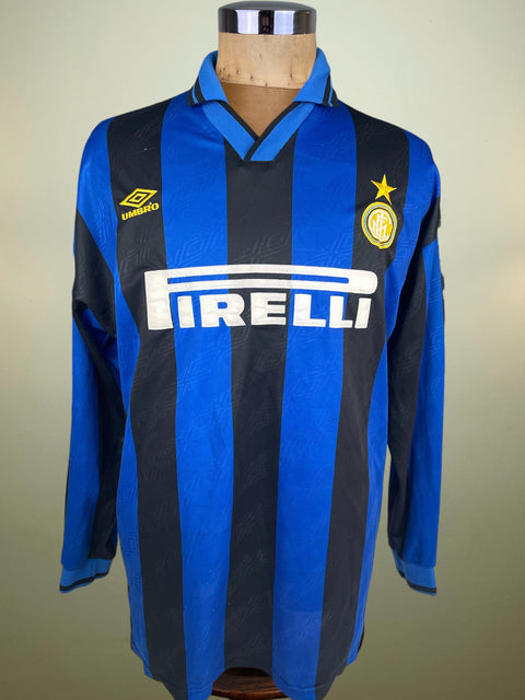 Inter home shirt in blue and black from 1995/96, worn by Nicola Berti. Long-sleeve Umbro issue with Pirelli sponsor, finished with BERTI 18 in flocked lettering and numerals.