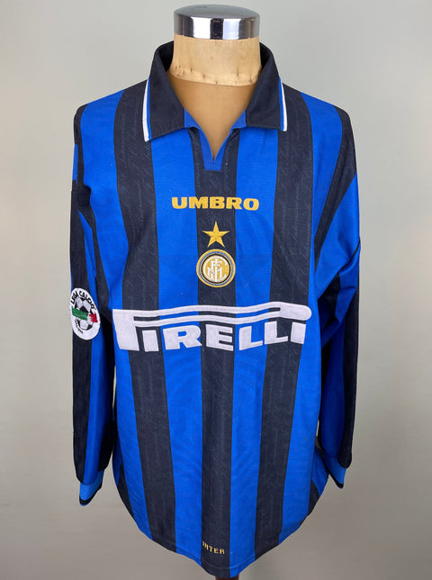 A match worn 1996-97 Javier Zanetti long sleeved home shirt with Pirelli sponsor on the chest and black and blue vertical stripes with Serie A patch on the sleeve.