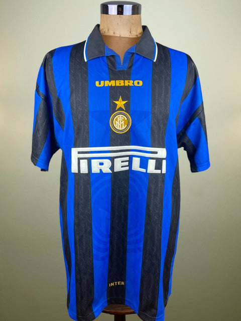 Javier Zanetti's Blue and black Inter Milan match worn football jersey with Umbro and Pirelli logos on a mannequin against a beige background