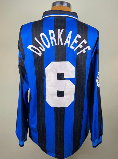 A long-sleeved 1996-97 match worn UEFA cup Inter Milan soccer jersey with a blue body and black accents, featuring the name 'DJORKAEFF' and the number '6' on the back.