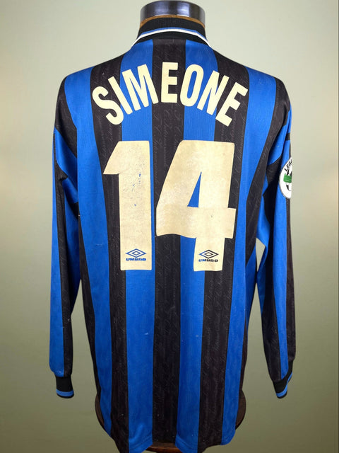 Diego Simeone's match worn long sleeved Inter Milan 1997-98 shirt with Blue and black stripes and 'Simeone' and number '14' in light flock on the back, against a plain background. This was worn against AC Milan as you can see from the error in the placement of the Inter logo on the chest.