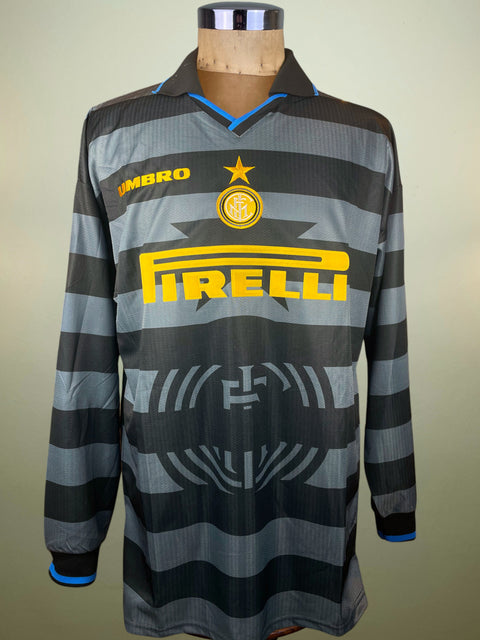 Striped Inter Milan Third jersey with brand logos on a mannequin against a plain background