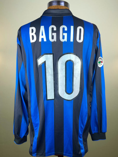 Blue and black striped sports jersey with 'BAGGIO' and number '10' on a beige background