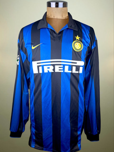Blue and black striped Inter Milan 1998-99 Nike jersey with Pirelli logo on a mannequin against a neutral background