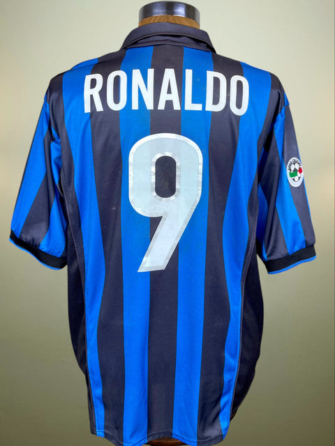 Soccer jersey with 'RONALDO' and number '9' on a mannequin against a beige background