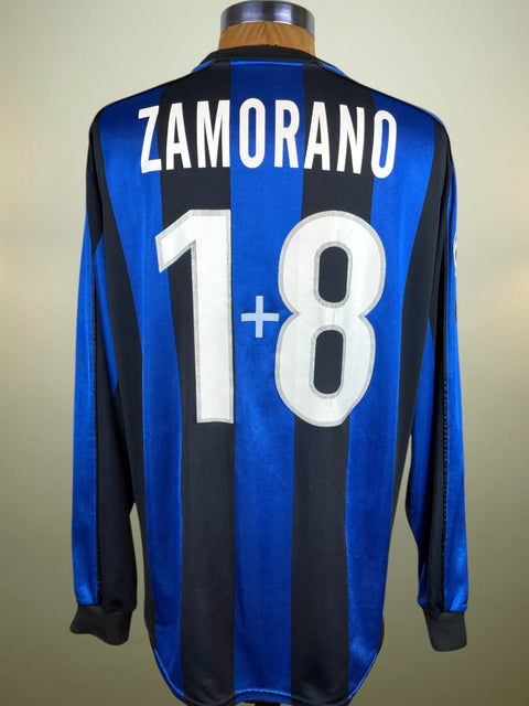 Inter home shirt (Nerazzurri), 1999/00 — Ivan Zamorano “1+8”. Long-sleeve Nike with Pirelli sponsor; finished with ZAMORANO 1+8 in lightweight plastic, season-correct silver-outlined print.