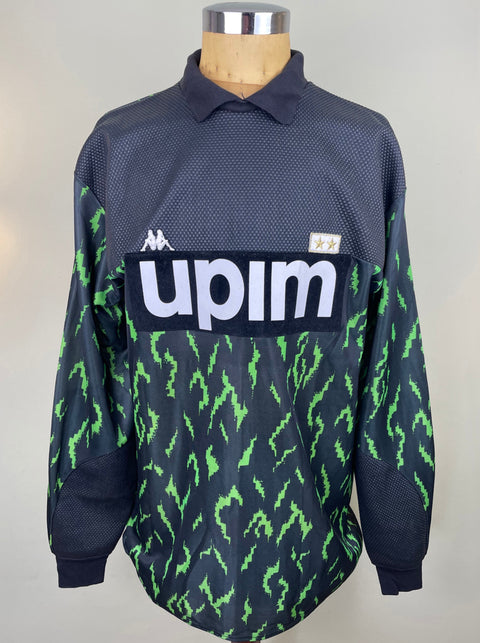 A long-sleeved match worn Stefano Tacconi Juventus goalkeeper jersey from the 1989 season with a green, black, and white camouflage pattern. The jersey features the UPIM sponsor on the chest in flock.